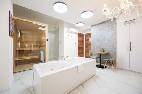 Deluxe Suite, Sauna, Basement | Living area | Smart TV