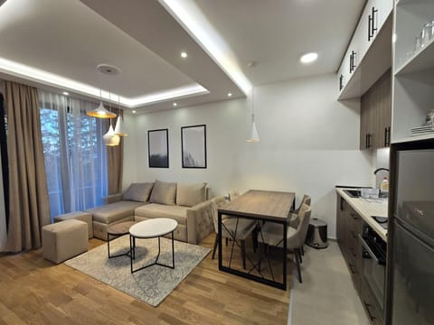 Comfort Apartment, Garden View | Living area | TV