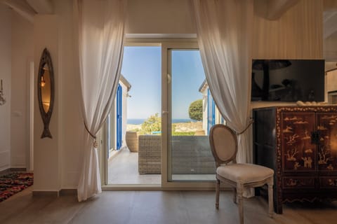 Villa, Garden View | Living area | 32-inch flat-screen TV with cable channels
