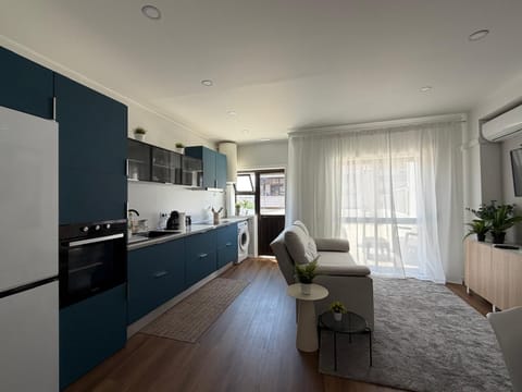 City Apartment, City View | Living area | Flat-screen TV