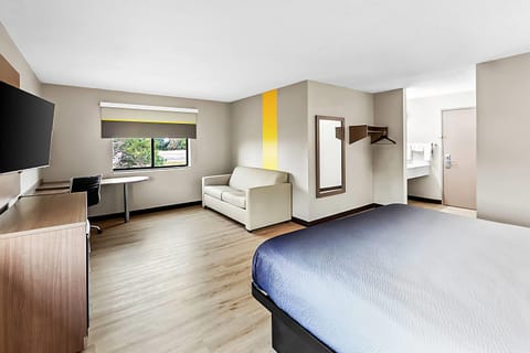 Suite, 1 King Bed, Non Smoking | Desk, laptop workspace, blackout drapes, free WiFi