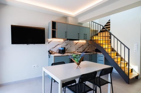 Deluxe Suite | Living area | 40-inch Smart TV with digital channels