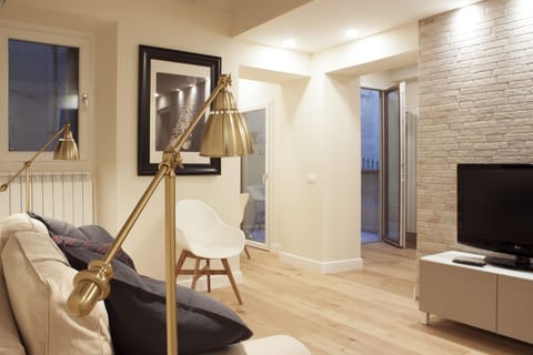 Apartment | Living area | 24-inch flat-screen TV with digital channels
