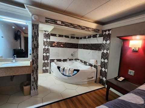 Desk, laptop workspace, blackout drapes, iron/ironing board