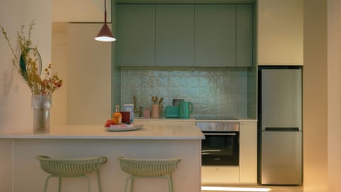 Luxury Suite, City View | Private kitchen | Microwave, oven, stovetop, toaster