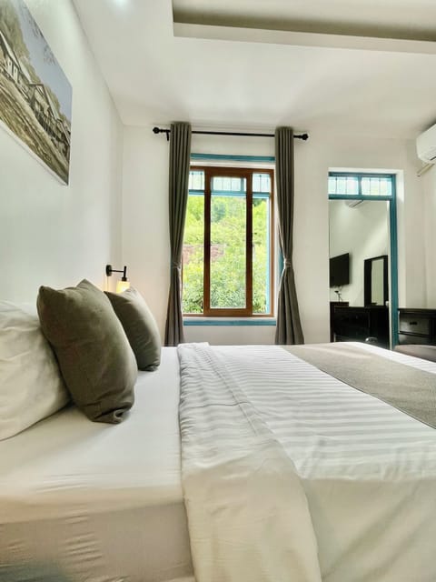 Family Triple Room, City View | Blackout drapes, soundproofing, free WiFi