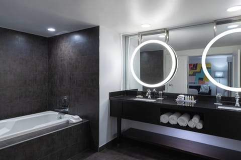 Designer toiletries, hair dryer, towels