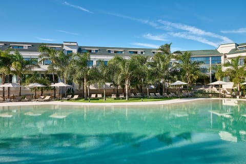 Seasonal outdoor pool, open 10:00 AM to 8:30 PM, pool umbrellas