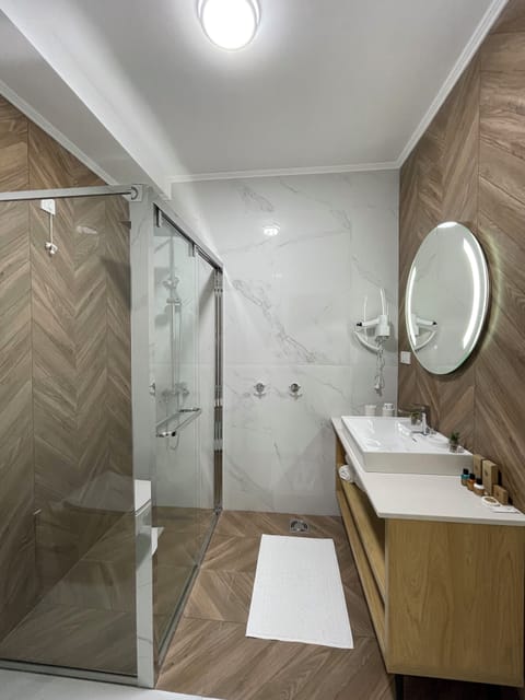 Apartment, City View | Bathroom | Shower, hair dryer, bathrobes, slippers