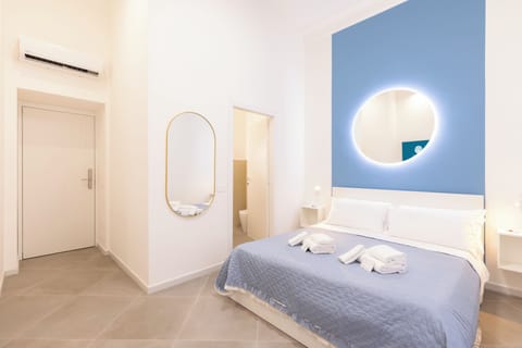 Deluxe Double Room, Balcony, City View | Minibar, in-room safe, desk, laptop workspace