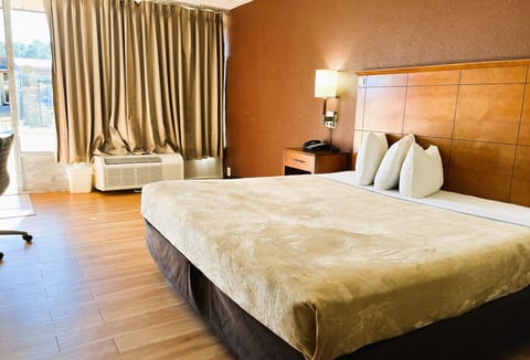 Room, 1 King Bed, Smoking | Desk, iron/ironing board, free WiFi, bed sheets