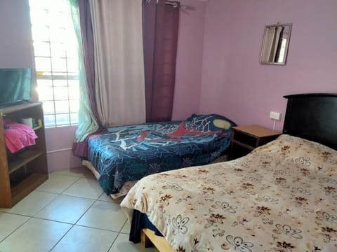Comfort Quadruple Room, Garden View | In-room safe, blackout drapes, iron/ironing board, free WiFi
