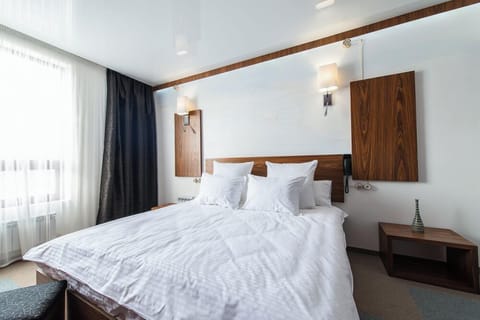Hypo-allergenic bedding available, down comforters, in-room safe