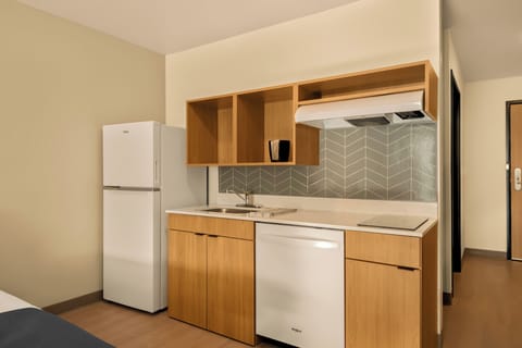 Suite, 2 Queen Beds, Roll-in Shower, Non Smoking | Private kitchen | Full-size fridge, microwave, stovetop, dishwasher