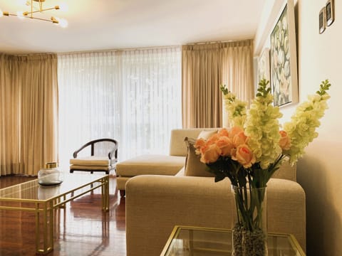 Family Apartment | Living area | 65-inch flat-screen TV with cable channels