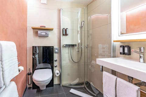 Shower, eco-friendly toiletries, hair dryer, bathrobes