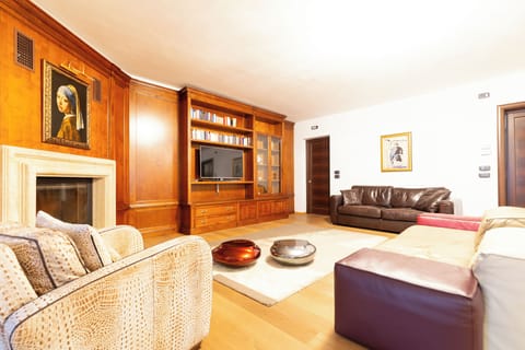 Luxury Condo | Living room | Flat-screen TV, fireplace, offices