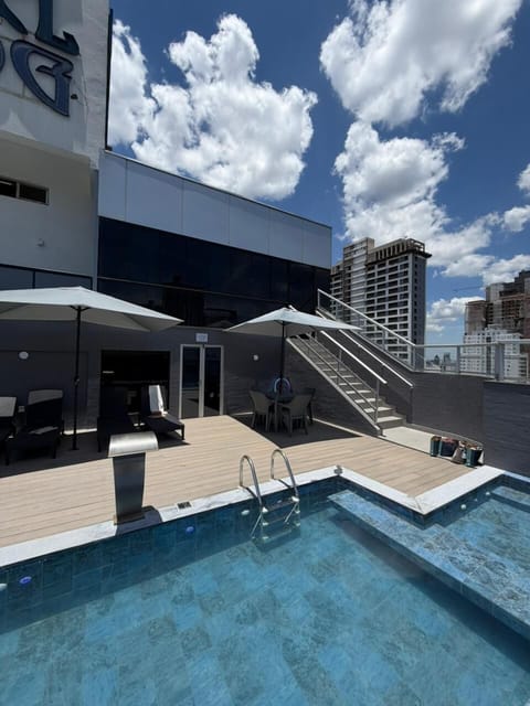 Seasonal outdoor pool, open 9:00 AM to 10:00 PM, pool umbrellas