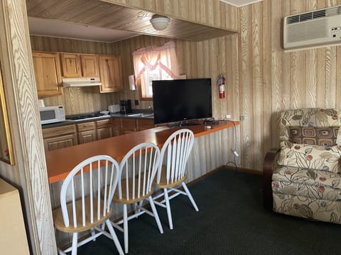 Premium Room, 2 Queen Beds, Kitchenette | Living area | Flat-screen TV