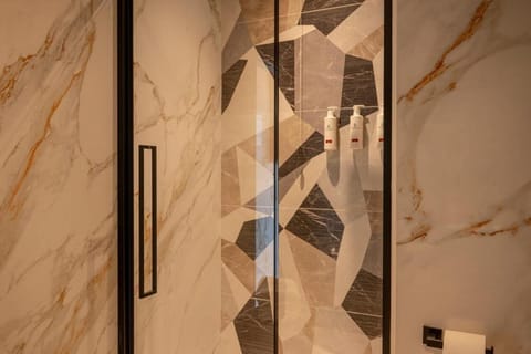 Luxury Room, Balcony, City View | Bathroom | Shower, hair dryer, slippers, towels