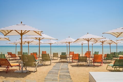 Private beach nearby, free beach shuttle, beach towels, beach bar