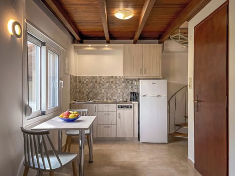 Mini-fridge, stovetop, cookware/dishes/utensils