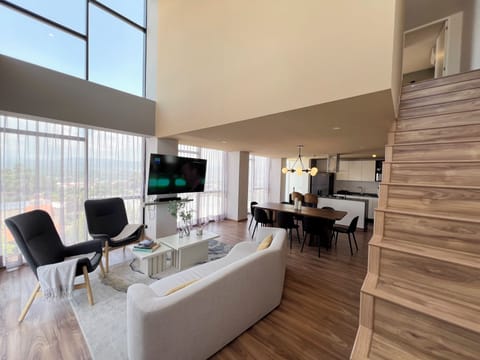 Luxury Apartment, Balcony, Mountain View | Living area | TV