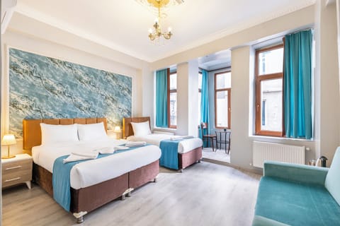 Deluxe Triple Room, City View | Soundproofing, free WiFi, bed sheets