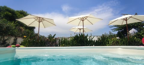 Outdoor pool, open 10:00 AM to 6:00 PM, pool umbrellas, sun loungers