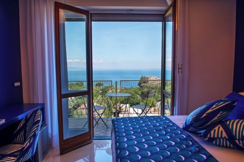 Panoramic Double Room, Balcony, Sea View | Minibar, in-room safe, desk, laptop workspace