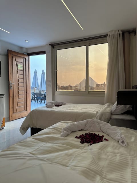 Deluxe Double Room, 2 Twin Beds, Mountain View | Free minibar, in-room safe, soundproofing, iron/ironing board