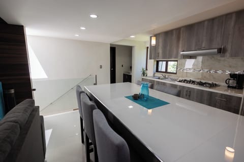 Suite, Balcony | Private kitchenette | Coffee/tea maker