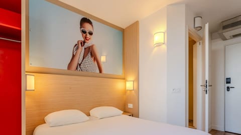 Premium bedding, desk, laptop workspace, blackout drapes