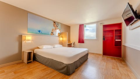 Premium bedding, desk, laptop workspace, blackout drapes