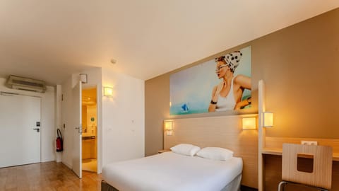 Premium bedding, desk, laptop workspace, blackout drapes