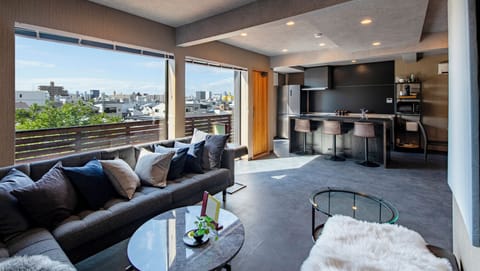 Deluxe Villa, Kitchen, City View | Living area | Flat-screen TV