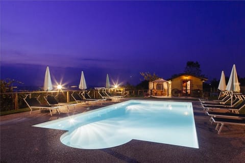Seasonal outdoor pool, open 8:00 AM to 8:00 PM, pool umbrellas