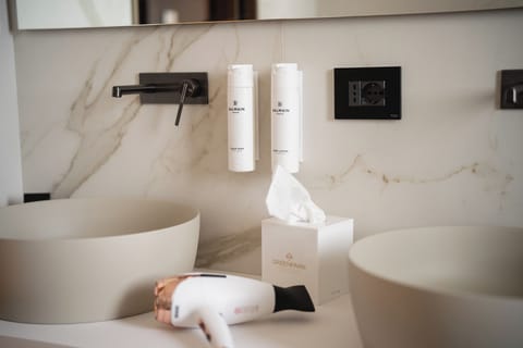 Luxury Suite, Pool View | Bathroom | Shower, hair dryer, slippers, towels