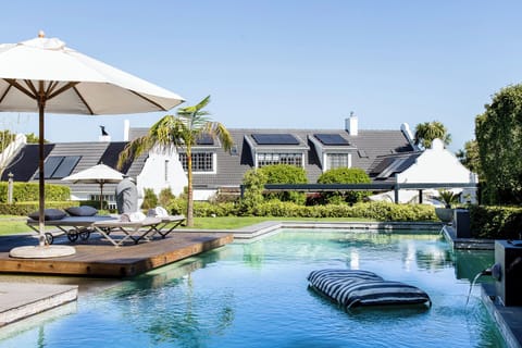 Outdoor pool, pool umbrellas, sun loungers
