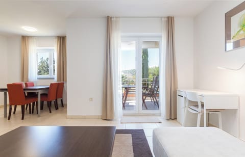 Family Apartment, 2 Bedrooms, Garden View | Living area | Flat-screen TV