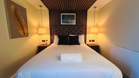 Premium bedding, memory foam beds, in-room safe, laptop workspace