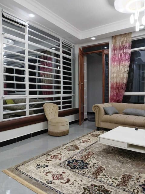 Family Townhome, Garden View | Living area | 64-inch Smart TV with digital channels