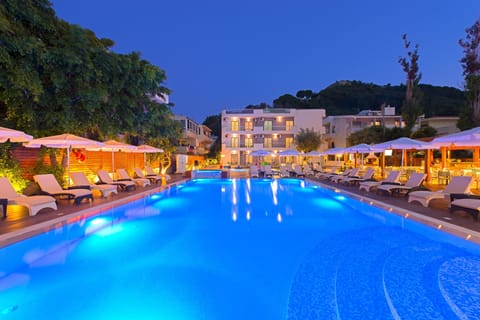 Seasonal outdoor pool, open 10:00 AM to 6:00 PM, pool umbrellas