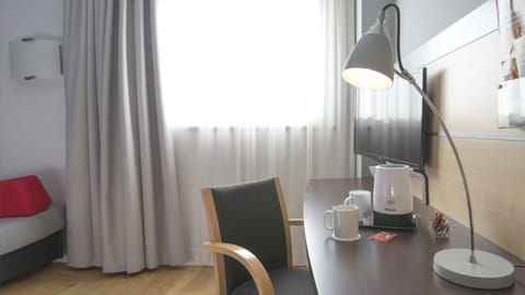 Desk, blackout drapes, soundproofing, iron/ironing board (on request)
