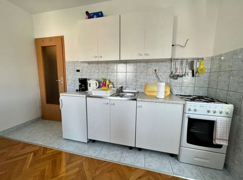 Apartment (One Bedroom Apartment with Balcony) | Private kitchen | Fridge