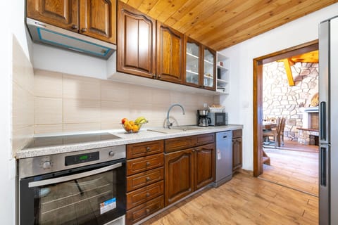 Villa | Private kitchen | Fridge, microwave, oven, stovetop