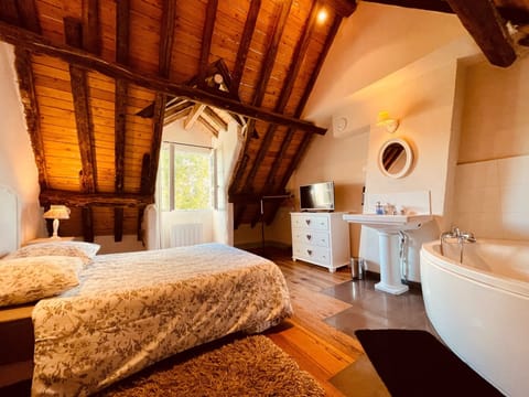 Premium bedding, desk, laptop workspace, blackout drapes