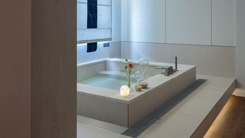 Signature | Bathroom | Hair dryer, slippers, towels, soap