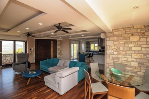 Villa | Living area | TV, fireplace