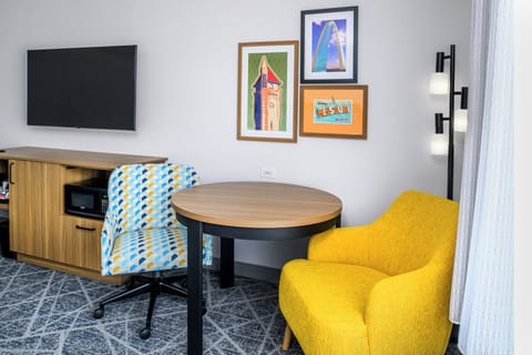 Premium bedding, desk, laptop workspace, blackout drapes